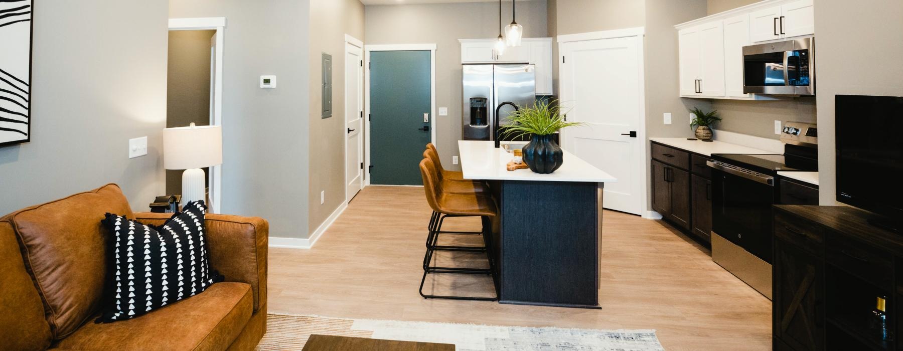 a living room with a table and chairs